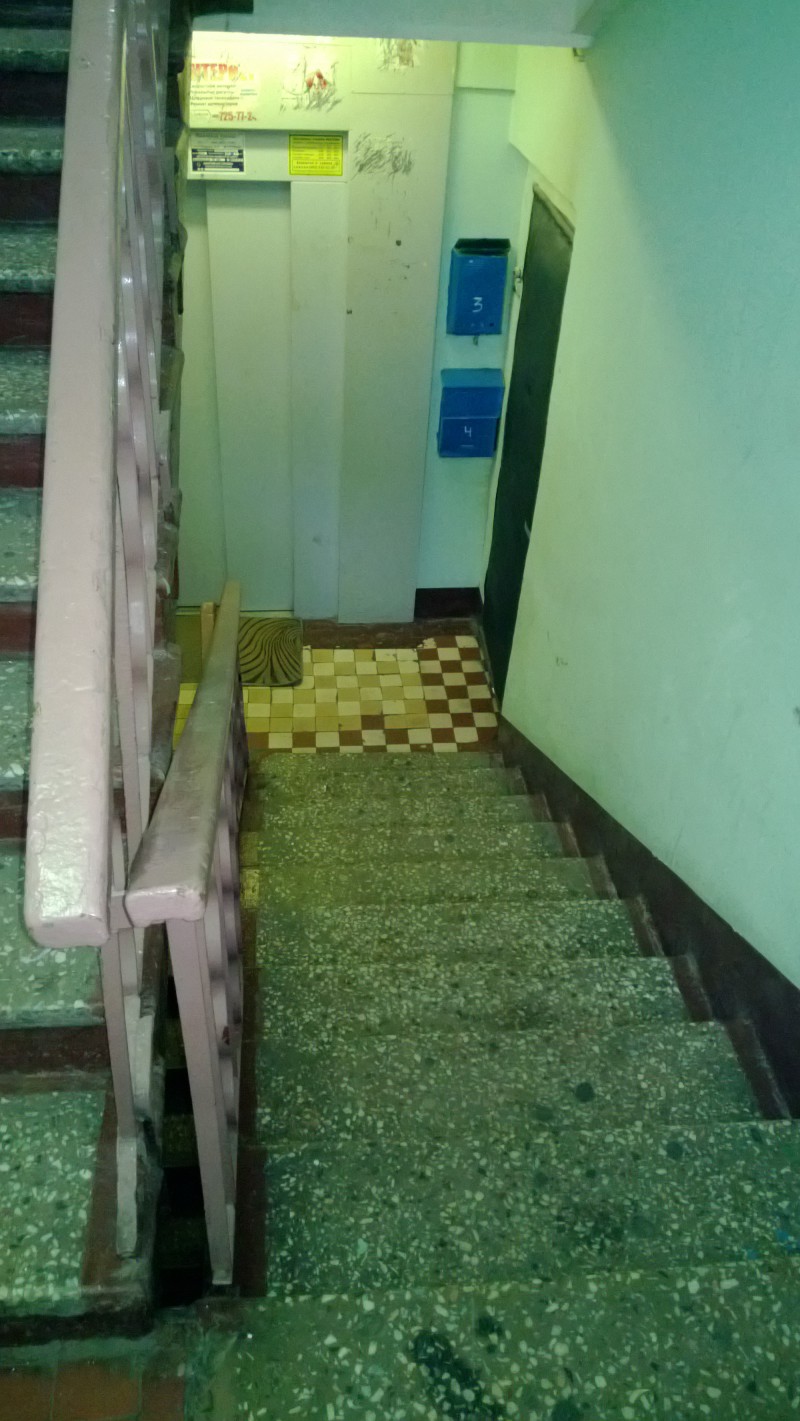 Stairwell, with lift at bottom of the stairs