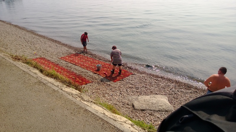 Cleaning carpets on the beach at Lake Baikal. You can do lots of things with a fresh water lake